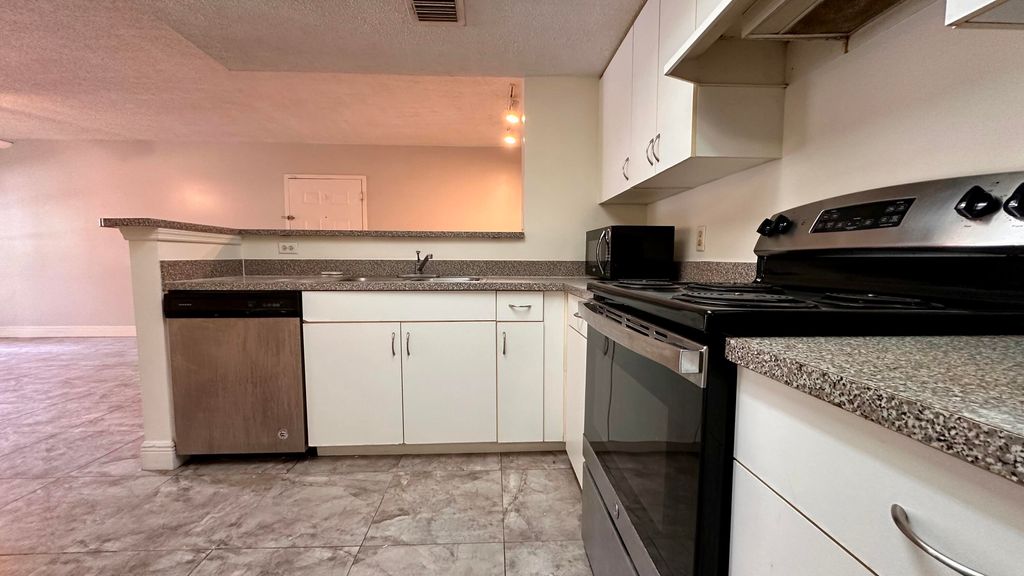 Photo of 5001 Wiles Road #103, Coconut Creek, FL 33073 (MLS # R10993912)