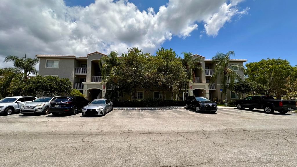 Photo of 5001 Wiles Road #103, Coconut Creek, FL 33073 (MLS # R10993912)