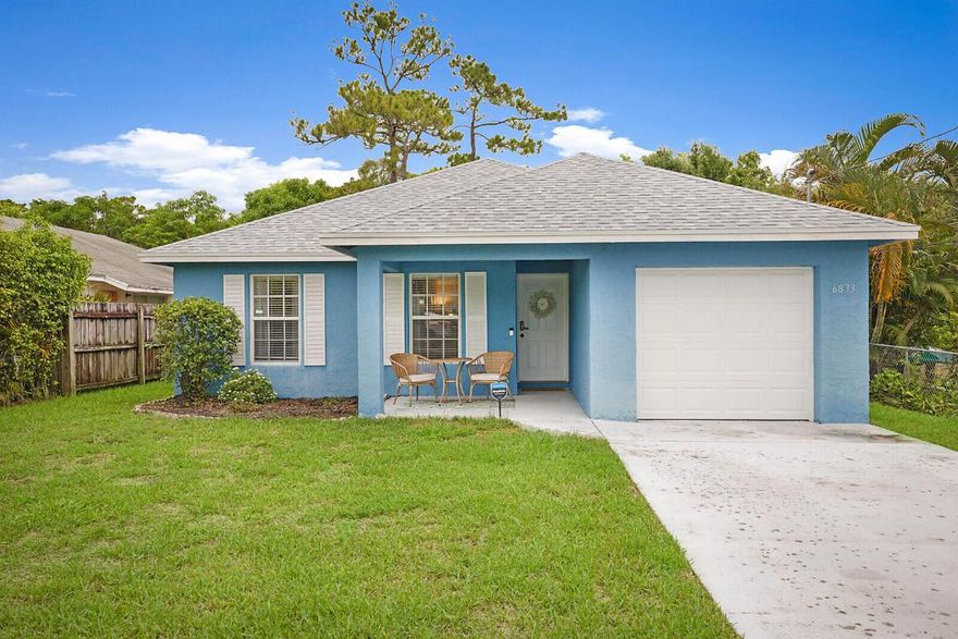 This charming three bedroom, two bathroom home is nestled in a quiet neighborhood on a dead end road. The first thing you'll notice is its tremendous curb appeal due to the newly planted clusia privacy hedges, painted exterior, and the brand-new roof, installed in December 2023, promising peace of mind and security for many years to come. Upon entry you'll step into an open and spacious atmosphere where every wall has been freshly painted and new floors have been installed. There is also plenty of room for a pool and the sky's the limit on creating a unique backyard oasis. This move in ready home is located just five miles from Jupiter's beautiful beaches and Riverbend Park and only two miles to both major highways. It's the perfect place to call home!