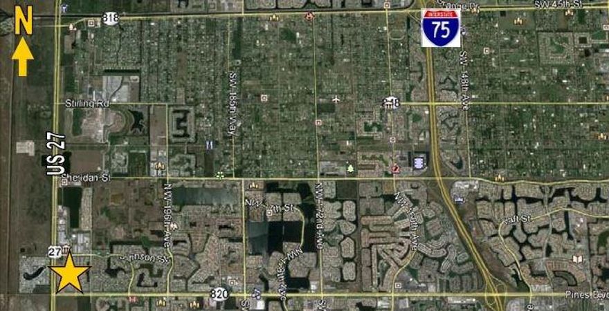 5 Acres of raw Industrial Land for sale. Located on US 27th just South of Sheridan Street, this site has 3.3 Acres of buildable land (1.7 Acres of mitigation area). The current owner had proposed to build approximately 30,000 SF of multi-bay warehouse