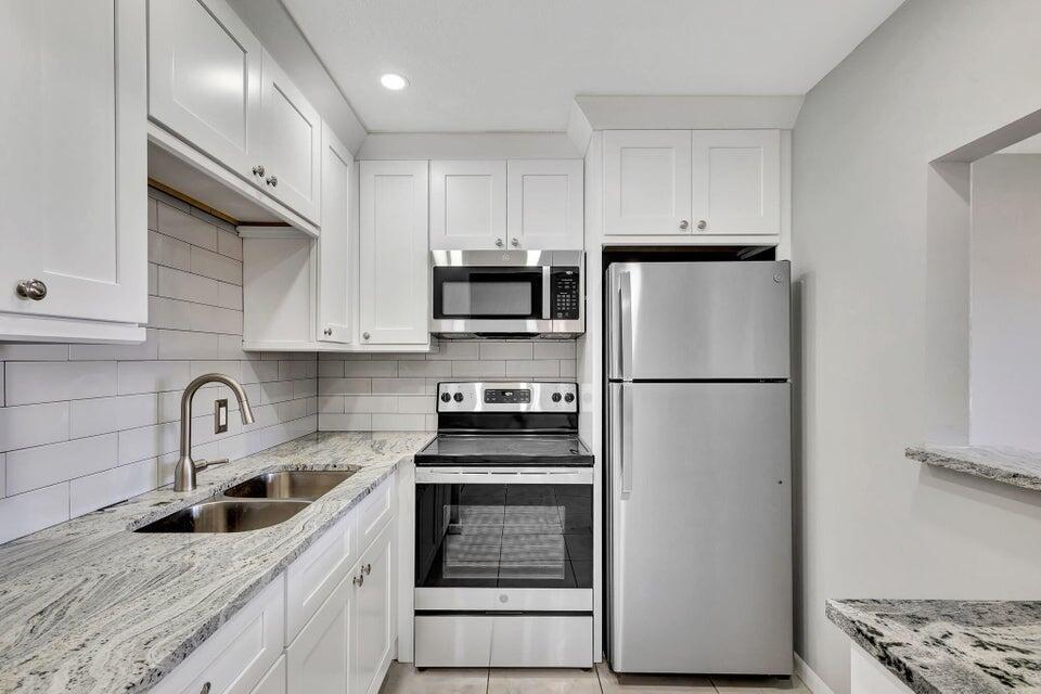 Just what your looking for. Remodeled ground floor unit. New kitchen with hardwood cabinets, soft close hardware. Stainless appliances. Gorgeous granite counters. Popcorn ceilings removed and knockdown texture applied. New bath vanity with granite. All Moen fixtures. Peaceful water view. Not many ground floor units this nice. Act now!!