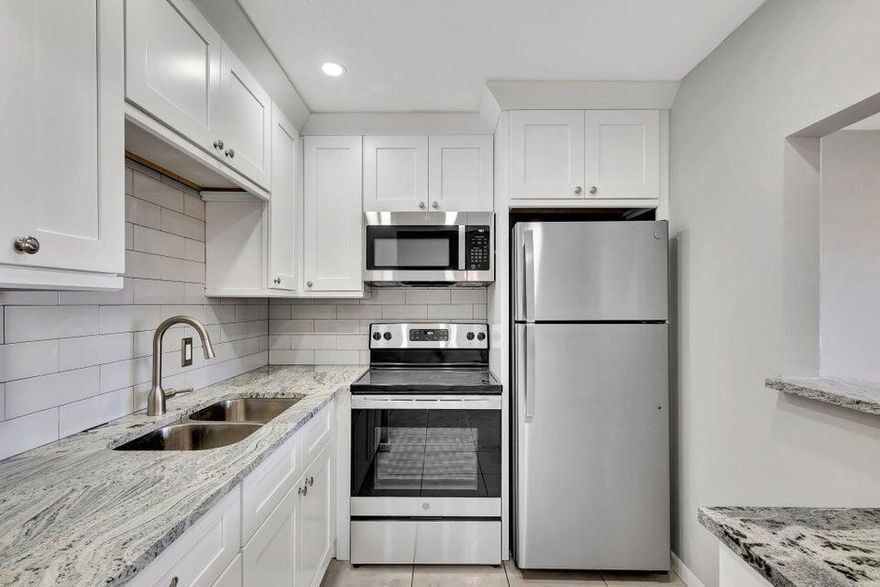 Beautifully remodeled ground floor unit in a gated 55 + community. This move in ready condo features a brand new kitchen with solid wood, soft close cabinetry, stainless steel GE appliances, and stunning granite countertops. The ceilings have been updated with smooth knockdown texture (no popcorn) and the bathroom includes a new hardwood vanity with granite top & Moen fixtures. Featuring a safe walk in shower. Enjoy peaceful water views from your private patio. Rarely available ground floor unit. Don't miss this opportunity to live in this sought after active adult community next to the Camden pool with a great Association and friendly neighbors. Just take one look and you will see the difference.