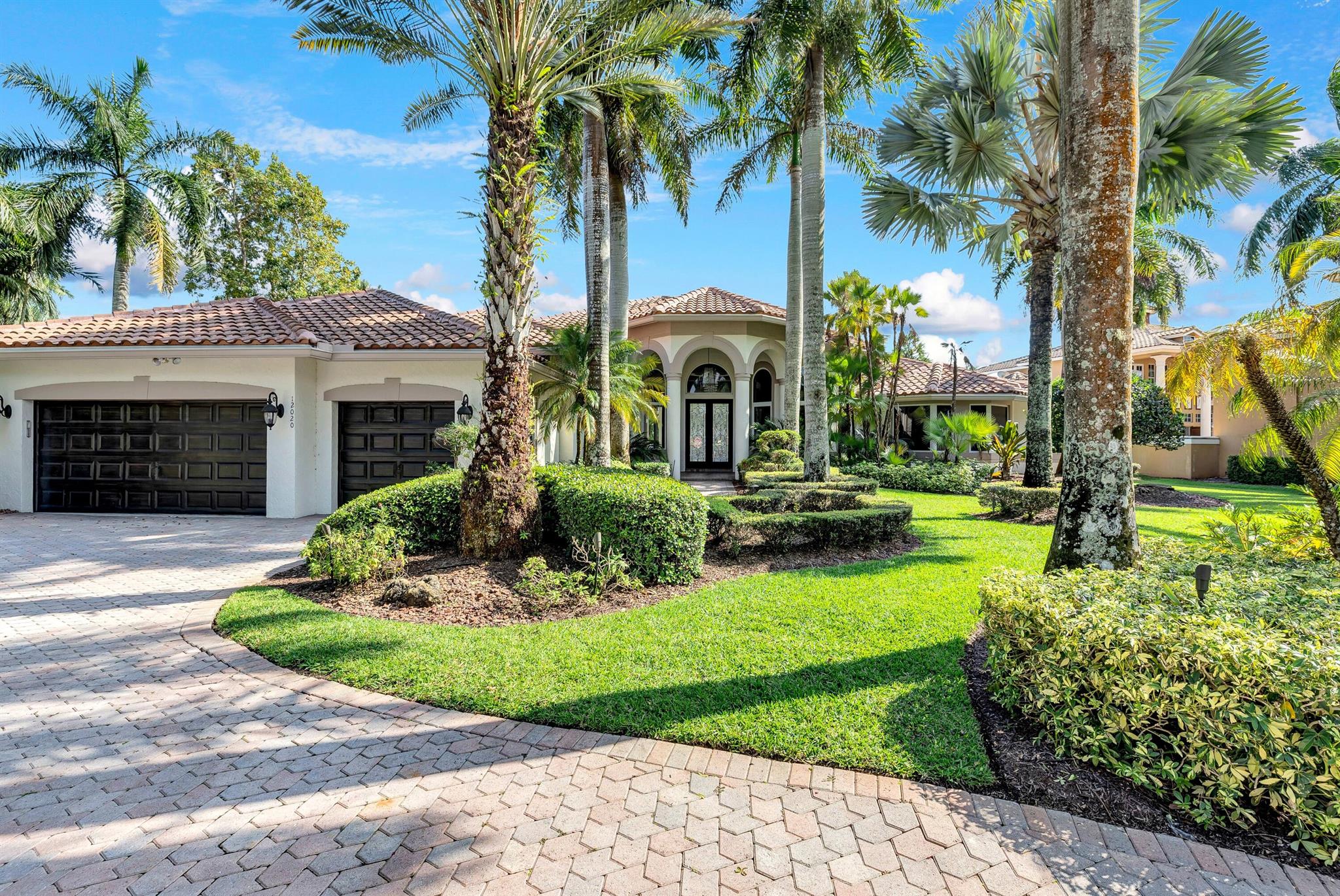 Stunning single-story home located in the prestigious double-gated community of The Falls at Heron Bay. Situated on a corner lot, this bright and spacious residence offers 5 bedrooms plus a home office with Murphy bed, 3 full baths, and 2 half baths. Impact windows throughout.Enjoy outdoor living with a travertine pool deck, spa, and summer kitchen. Interior features include 18' ceilings, wood floors, renovated bathrooms, and a chef's kitchen with white shaker cabinets and Quartz countertops.The private primary suite overlooks the backyard and pool, featuring motorized blinds, custom walk-in closets, and a beautifully updated bathroom with dual sinks and dual toilets.Zoned for Parkland's top-rated A-schools. This is luxury living at its finest!