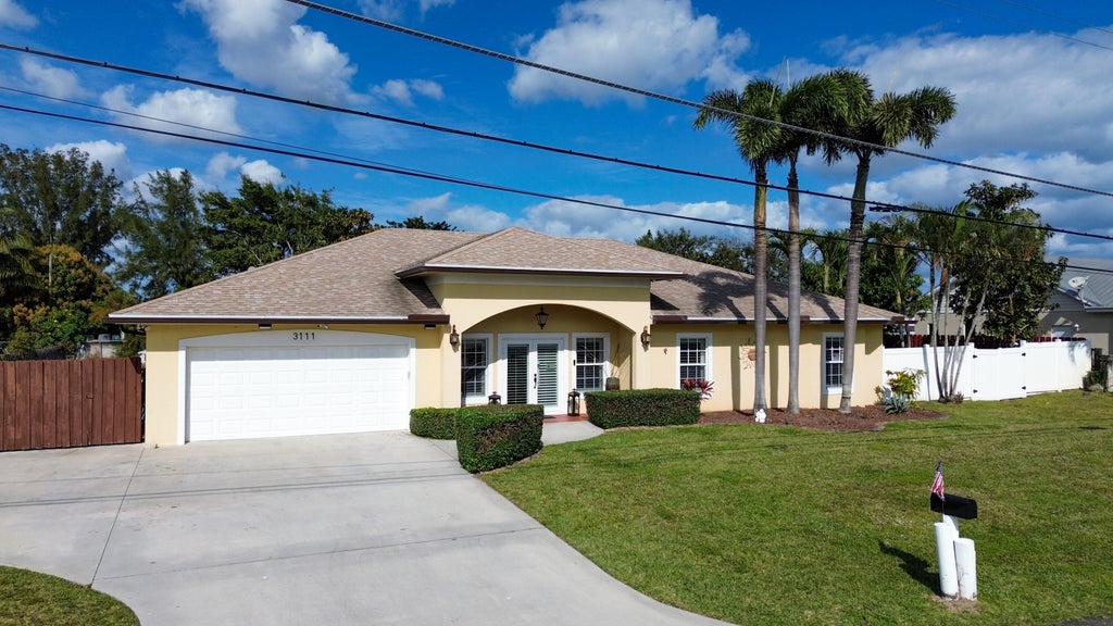 Photo of 3111 Buccaneer Road, Lake Worth, FL 33462 (MLS # R11053150)