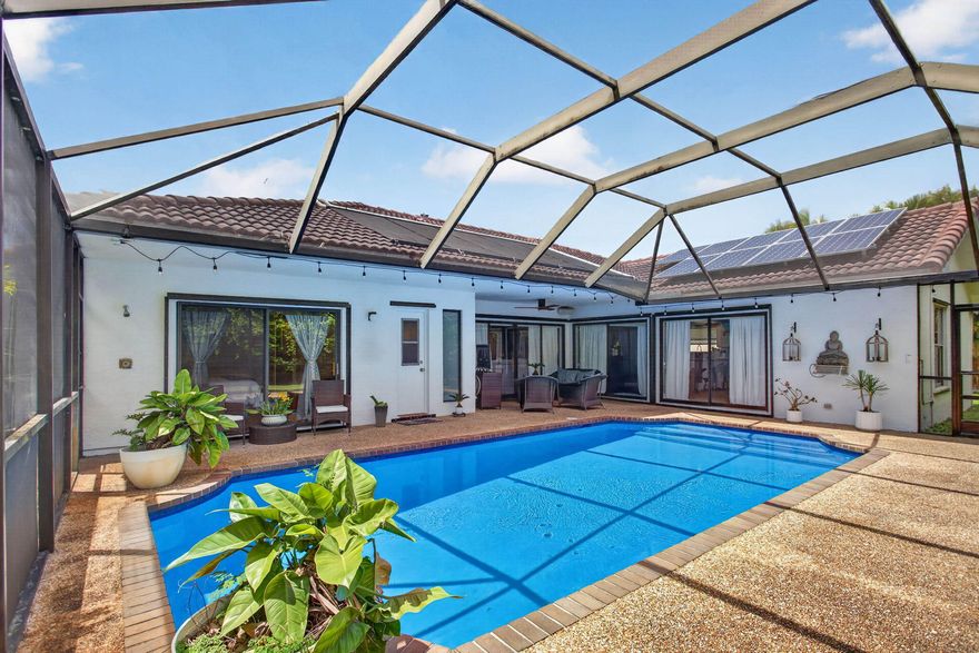 Beautiful Coral Springs POOL home on a quiet cul de sac, featuring bright open living, dining, and kitchen spaces that flow to a resurfaced, screened in pool—perfect for year round Florida living. The kitchen offers granite countertops and stainless steel appliances, with updated bathrooms, tile and laminate flooring, built in ceiling speakers, and prewired networking. Energy saving upgrades include a 5kW solar system, solar water heater, solar + electric pool heaters, and a variable speed pump. Large primary suite with walk in closet, plus a 2 car garage with attic storage. Move in ready and truly stands out.