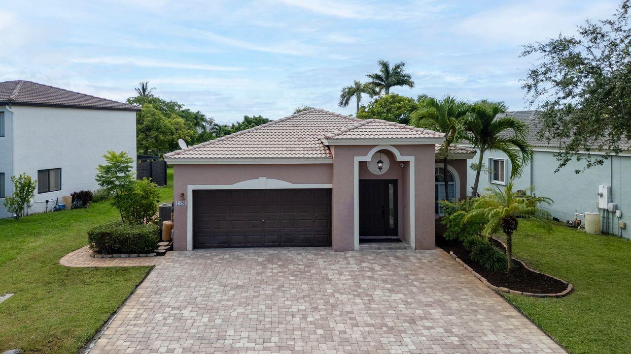 Beautiful 3/2 one Story Home in Prestigious "The Waterways" a Gated Community in Deerfield Beach. This home has been updated and has so much to offer. It has an Open Concept Plan, Neutral Colors, Marble Look Porcelain Tile and Laminate Wood Floors. Enjoy the Adorable Kitchen with Samsung SS Appliances, and a Fantastic Granite Island, great for Entertaining. Spacious Family-Room, High Ceilings, Recessed Lighting. Master Bedroom w/ Large Walk-In-Closet. Master Bathroom w/ Separate Shower & Roman Tub, Double Sinks. Laundry-Room w/ Samsung Front Loaders W/D. New AC in 2019. Guest Bathroom totally Remodeled. Garage for 2 Cars but the Expanded Paved Driveway fits 6+ Cars. Relax at the Extended Screened in Patio and Enjoy the Beautiful Backyard. Low HOA Fee! Pools, Clubhouses, Gym,Tennis & more