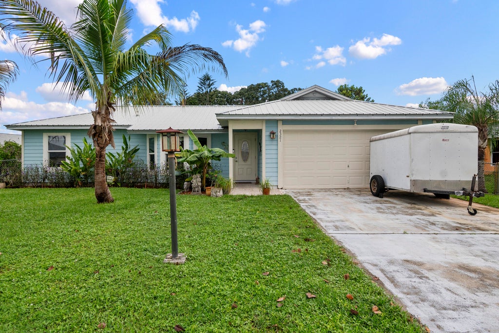 Photo of 2321 SE MASLAN Avenue, Port Saint Lucie, FL 34952 (MLS # B26077759)