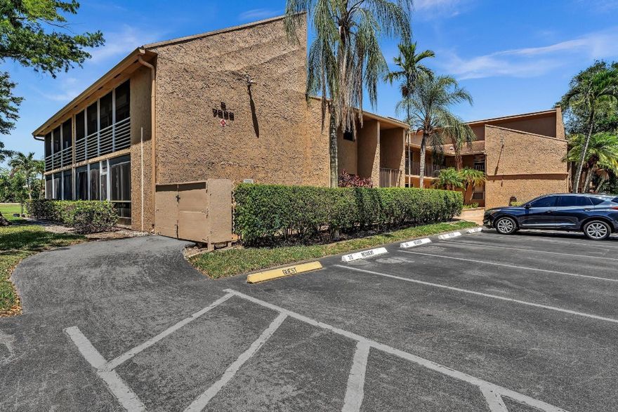 Beautifully remodeled second-floor unit with stunning golf course and lake views! This spacious residence features two ensuite bedrooms, each with its own private bathroom—perfect for privacy and comfort. Enjoy indoor-outdoor living on the tiled, screened-in wraparound balcony, ideal for relaxing or entertaining. The updated kitchen boasts wood cabinetry, granite countertops, and stainless steel appliances. Both suites offer a large walk-in closet, and the convenience of an in-unit washer and dryer adds to the home's functionality. Complete with hurricane shutters for peace of mind, this unit combines style, comfort, and practicality.