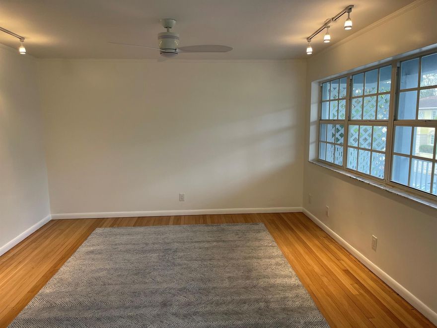 In-town, at 234 Oleander, Residence 5, an updated and well-maintained two-bedroom, one-bath apartment in an exceptionally convenient Palm Beach location. The bright living area connects to a clean, streamlined kitchen, with an in-unit washer and dryer. One off-street parking space is included. Offered unfurnished for annual lease beginning in January.