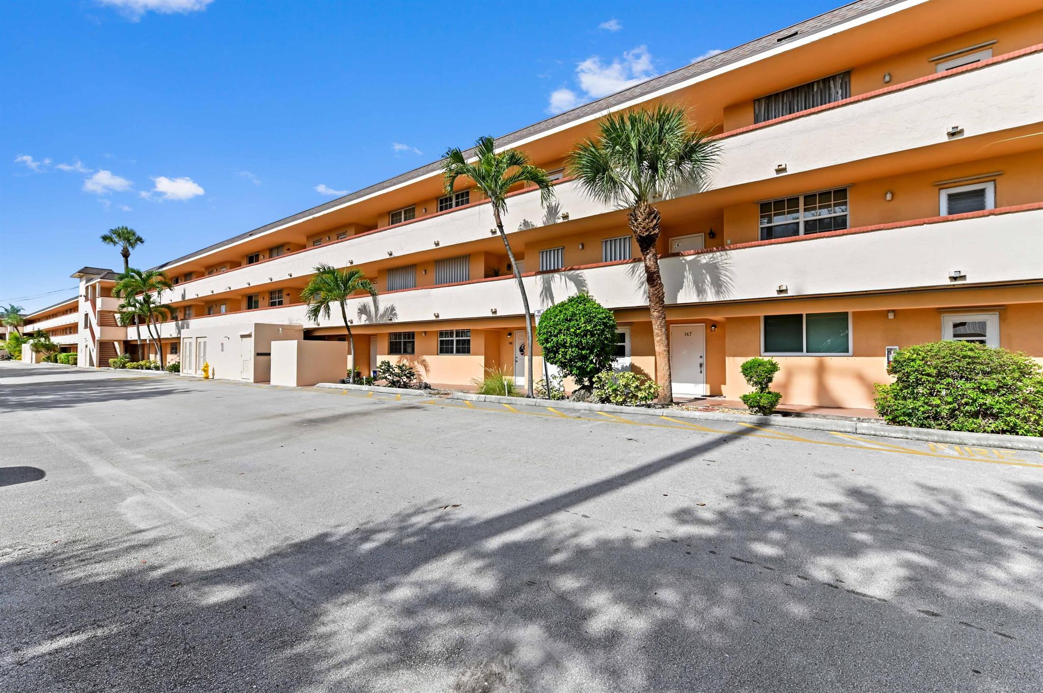 Welcome to Lighthouse Point Plaza Condo, a charming 3-story community offering comfort and convenience in the heart of Lighthouse Point. This 1st-floor unit features 984 square feet of living space, comprising 2 bedrooms and 2 bathrooms. The entry foyer with a closet leads to a kitchen with cabinet storage, refrigerator, microwave, and range/oven, flowing into the dining and living areas.The home features tile flooring in the main areas and laminated flooring in the bedrooms. From the living room, sliding doors with accordion shutters open to a screened and covered patio with a peaceful pool view. Additional highlights include accordion shutters throughout for storm protection.