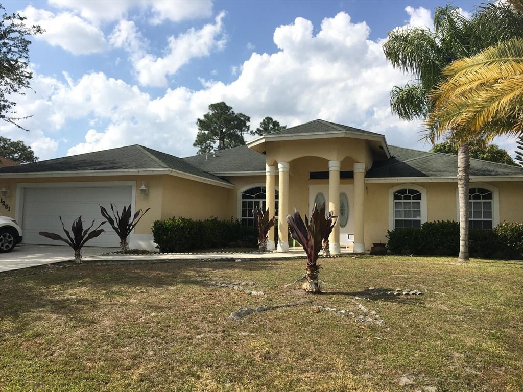 Photo of 1261 SW Fountain Avenue, Port Saint Lucie, FL 34953 (MLS # R10706990)