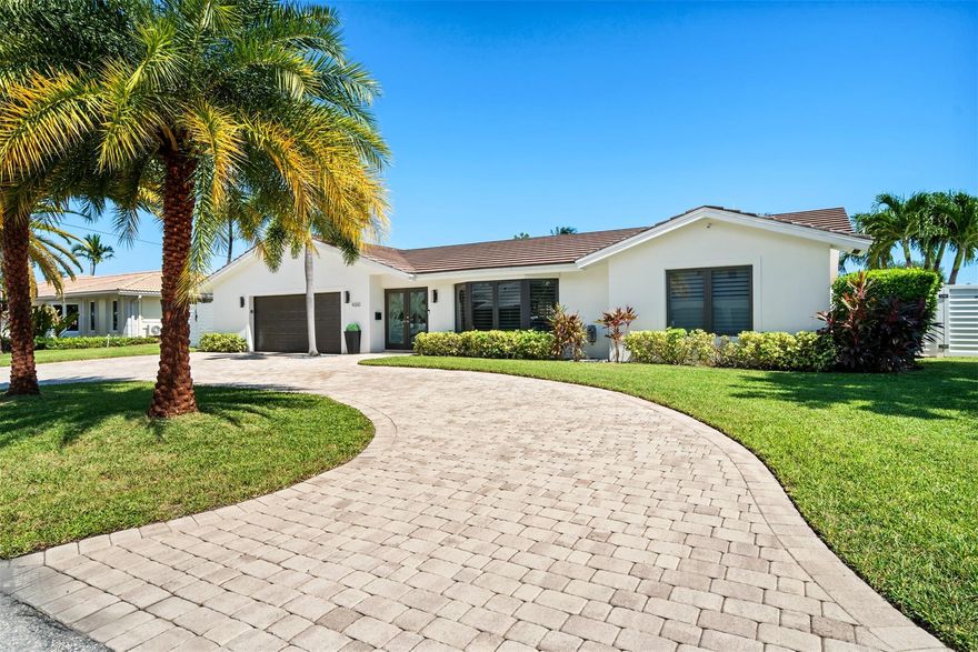 Experience the pinnacle of Lighthouse Point waterfront living in this breathtaking Venetian Isles deepwater estate, with direct access to the Intracoastal, Hillsboro, and Boca inlets. This meticulous updated home boasts an open-concept layout bathed in natural light through a stunning bay window. Brand New Roof and hurricane impact doors & windows! Featuring Italian porcelain floors throughout and modern updates, it captures panoramic water views while seamlessly connecting indoor and outdoor spaces. Step outside to your private resort-style oasis, where an expansive deck leads you to 90ft prime waterfrontage with 10,000lb boat lift overlooking a 100ft wide canal! Boater's Dream!
*3rd & 4th bed combined to an expansive master suite, can be easily converted back to original 4/3 floorplan.