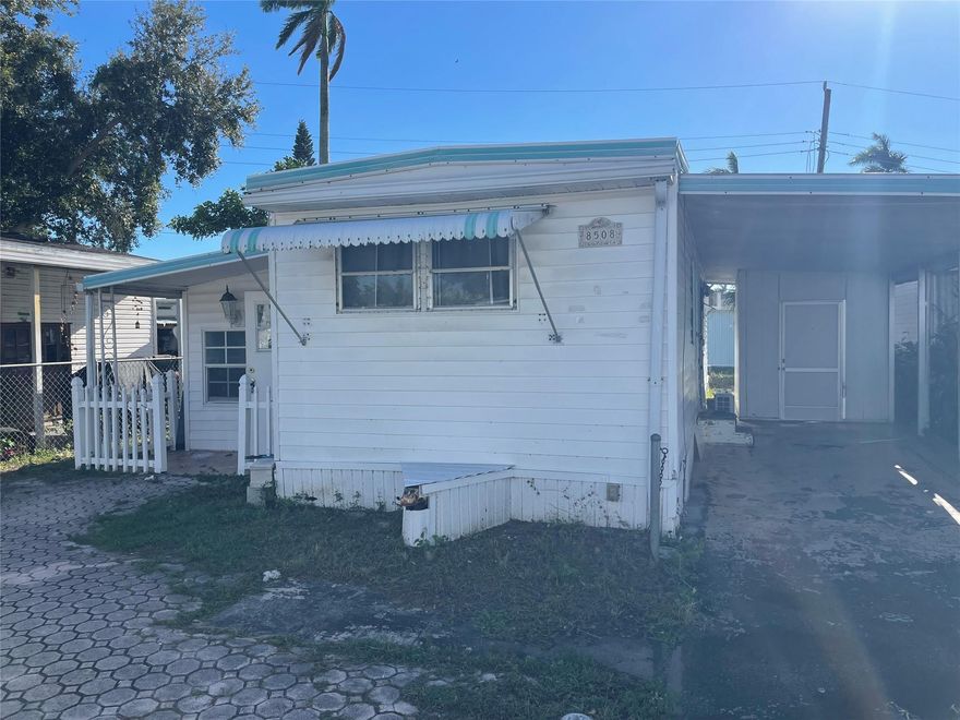 Beautiful 3/2 that has a feel of a double wide - sq ft seems larger than tax rolls - -split bedroom plan - -gorgeous wood laminate floors through out - -carport - shed - -assoc. states it is HOPA verified - -a must see..........