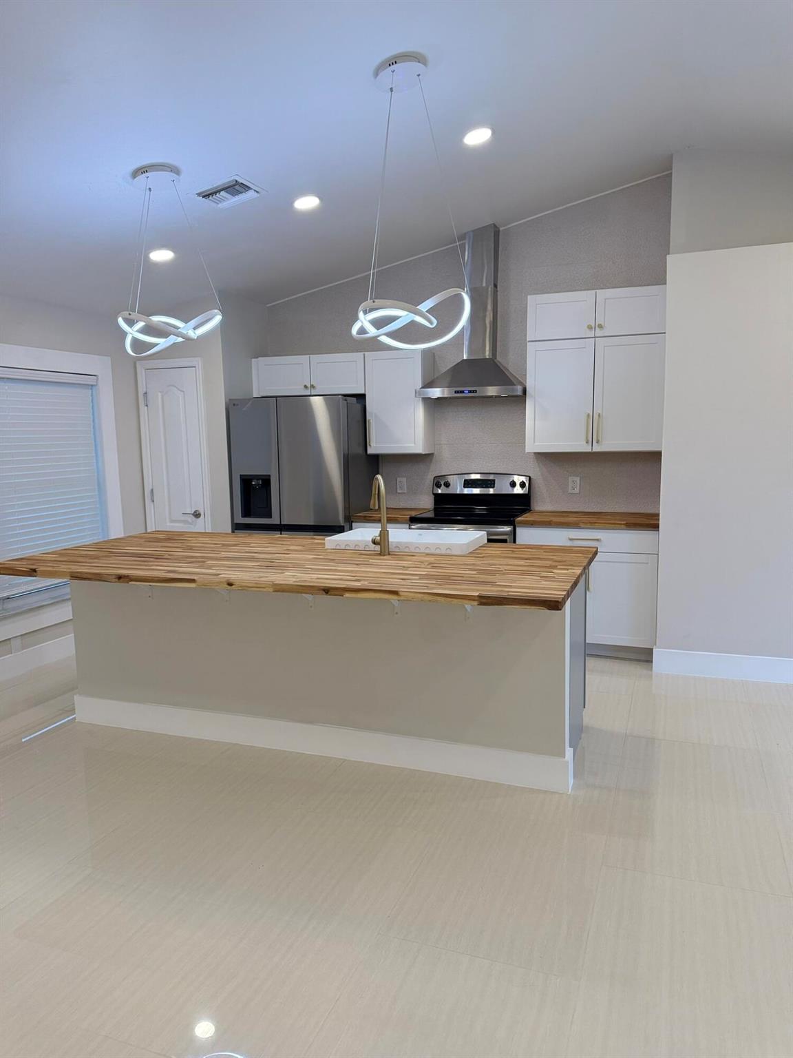 Stunning fully remodeled 3 bed, 2 bath Cape Coral home with 2024 roof! Enjoy a brand-new kitchen with all new appliances, sleek tile flooring throughout, and modern LED lighting. Both bathrooms are fully updated with undercabinet lighting; the primary suite boasts dual showerheads. Energy-efficient impact windows provide peace of mind. Spacious 2-car garage with epoxy flooring. No HOA, and plenty of room to park your boat or RV--or even add a pool! This move-in-ready gem blends style, comfort, and future potential.
