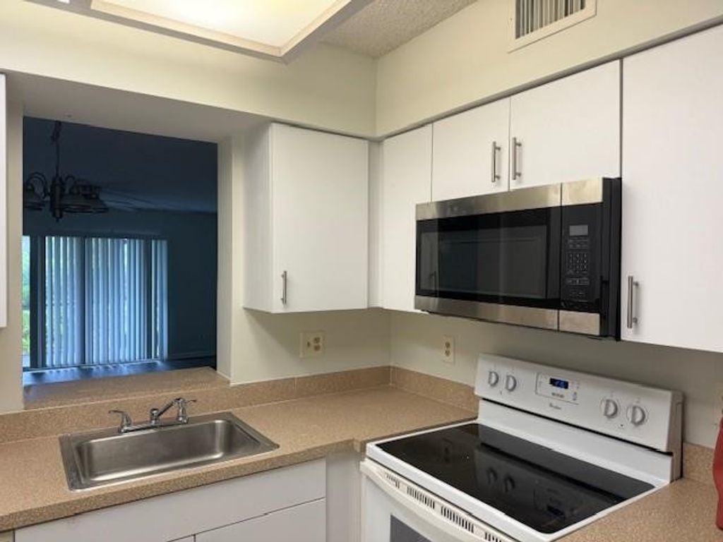 Photo of 2212 S Cypress Bend Drive #104, Pompano Beach, FL 33069 (MLS # F10487492)