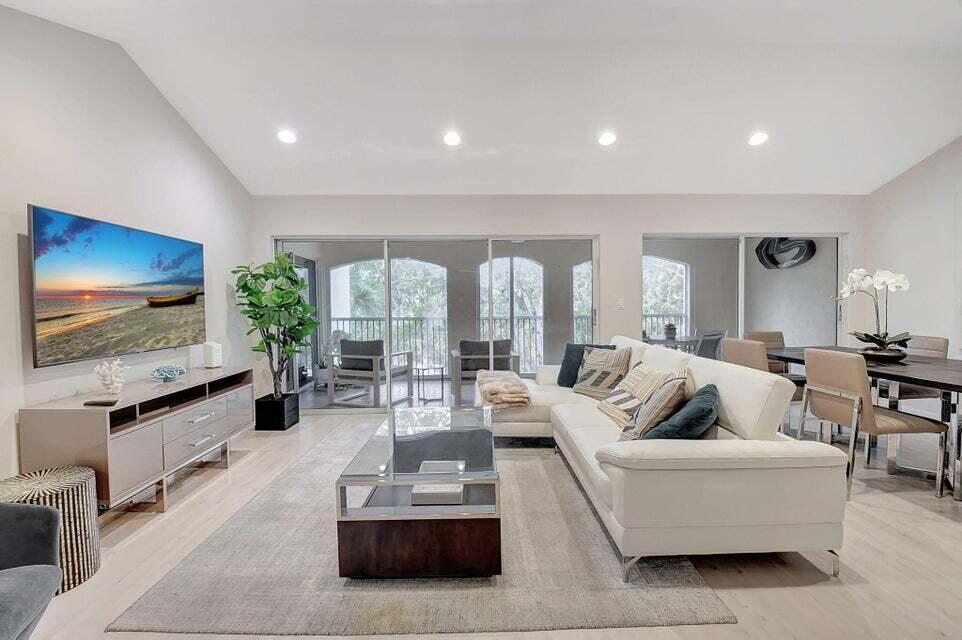 Enjoy the Florida lifestyle in this gorgeous 3rd-floor condo in Boca Grove Country Club. This unit features a spacious dining area that is perfect for entertaining, plus a lake-view enclosed balcony. Features include 2 bedrooms, 2 bathrooms,, high ceilings, and the unit includes one covered parking space. Boca Grove amenities include access to incredible golf, 12 har-tru tennis courts, 1 red clay court, 5 pickleball courts, 2 brand new Padel courts, and a newly remodeled resort style pool and fitness center.