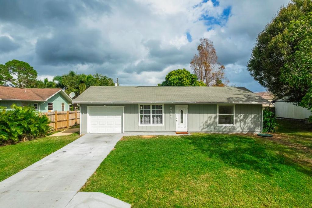 Photo of 733 SE Academy Lane, Port Saint Lucie, FL 34984 (MLS # R10951309)