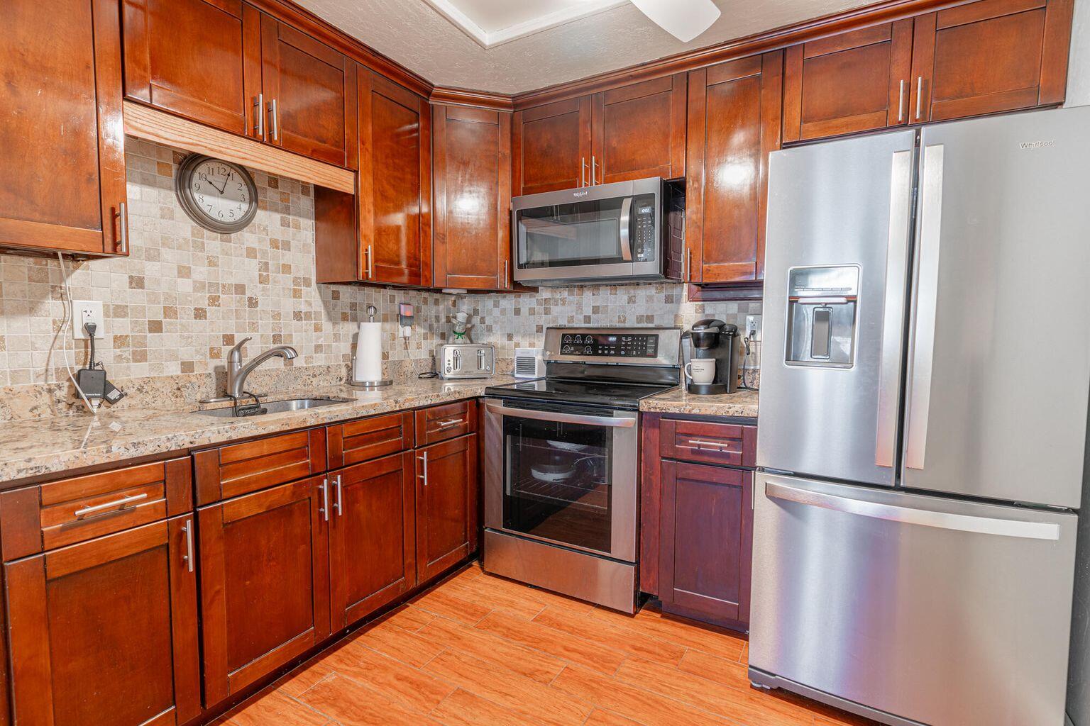 Discover a one-of-a-kind gated community in the heart of Delray Beach, offering every amenity to keep you living your best life! Just steps from your door, you'll find your own slice of paradise - and with low HOA fees, it's even sweeter.This desirable first-floor corner unit features impact windows, stylish plank flooring, cherry wood kitchen cabinets with granite countertops, brand-new stainless steel appliances, a 2019 AC, and a new hot water heater.Enjoy resort-style amenities including courtesy bus service, sparkling pools, a world-renowned theatre and cafe, on-site restaurant and bistro, plus endless clubs and events.Motivated seller - bring your offer today!