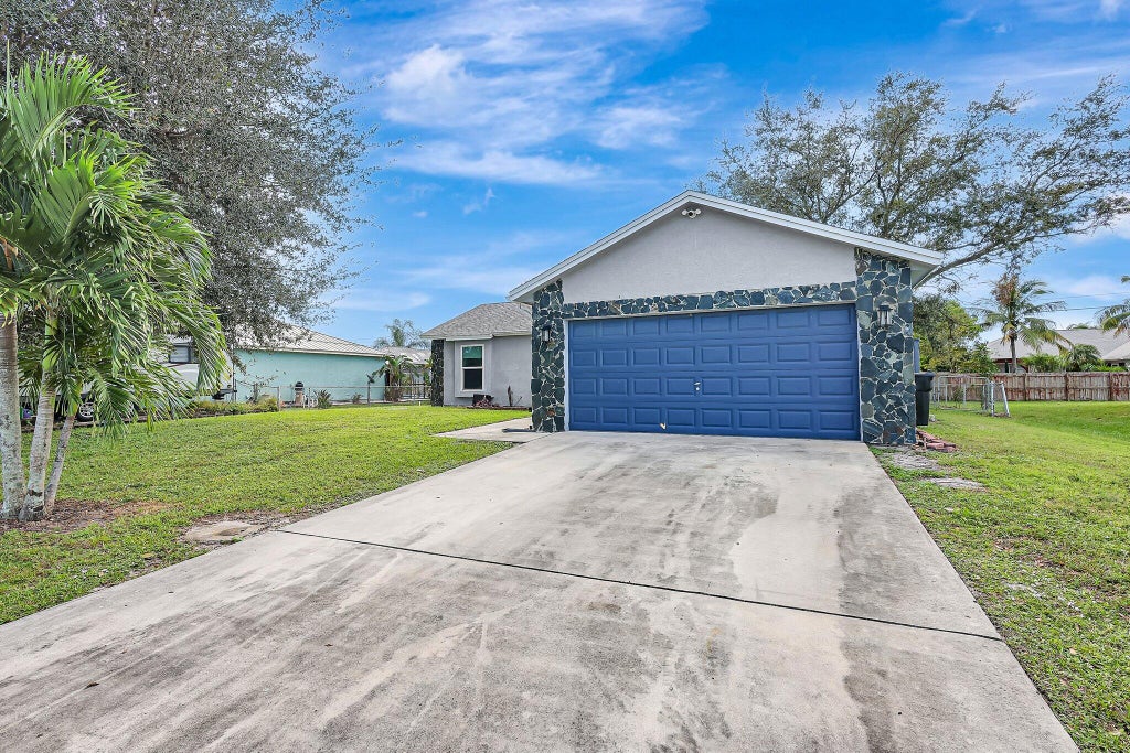 Photo of 552 SW Lawler Avenue, Port Saint Lucie, FL 34953 (MLS # R11034906)