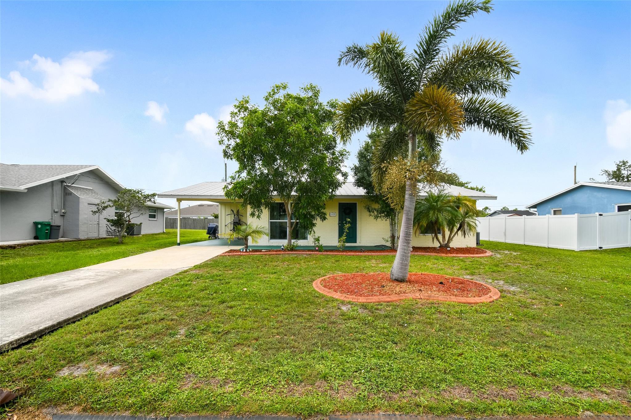 Welcome to 118 SW Ray Ave! This charming Port St. Lucie home sits on a spacious 0.23-acre lot with desirable southwest front exposure, offering gorgeous natural light throughout the day. Inside, you'll find a comfortable layout perfect for everyday living or entertaining. The large backyard provides endless possibilities—plenty of room for a pool, garden, or your own private oasis. Conveniently located near schools, shopping, and major highways, this home offers both comfort and convenience. Don’t miss this one!