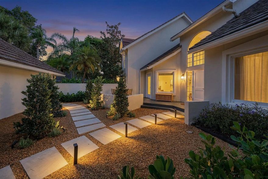 Stunning fully remodeled Muirfield townhouse offering private waterfront views in a premier location. The oversized primary suite evokes a luxury hotel experience with a dramatic wall of windows overlooking the water. Open concept living and dining areas complemented by a private front courtyard. Located within the gates of Palm Beach Polo, this property offers the best of country club living while maintaining a private and peaceful atmosphere.