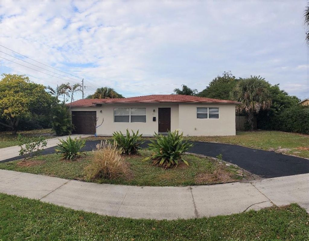 Photo of 455 Date Palm Drive, Lake Park, FL 33403 (MLS # R10682876)