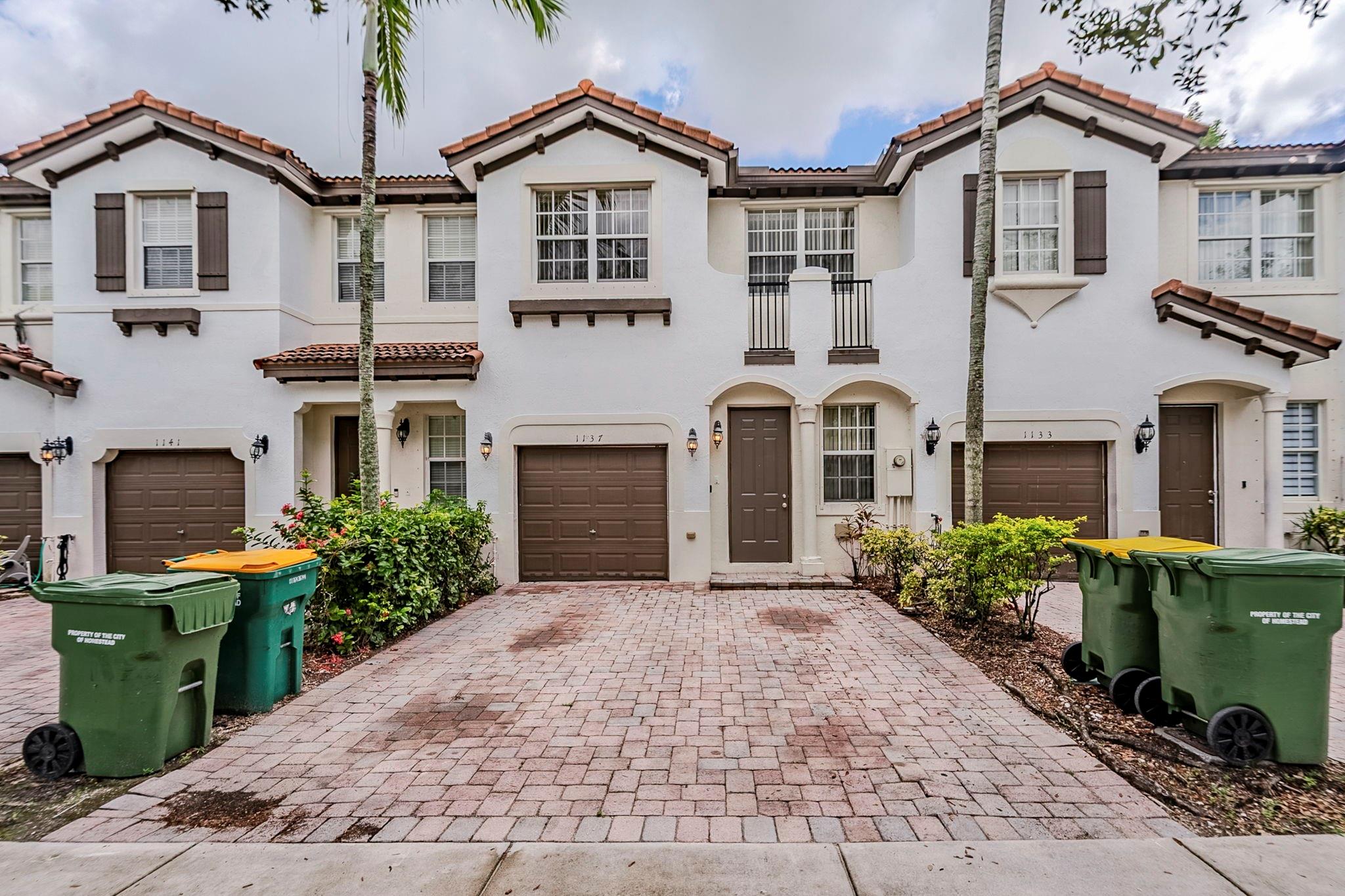 Spacious two-story townhouse featuring 4 bedrooms and 3 bathrooms with a 1-car garage. The kitchen includes a convenient bar and pantry, perfect for meal prep and entertaining. One or more photos have been virtually staged to showcase the home's potential. Schedule a showing today!