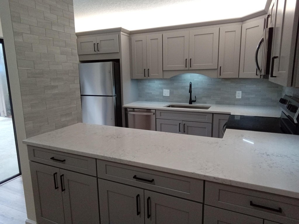 Photo of 105 1st Court, Palm Beach Gardens, FL 33410 (MLS # R11021609)
