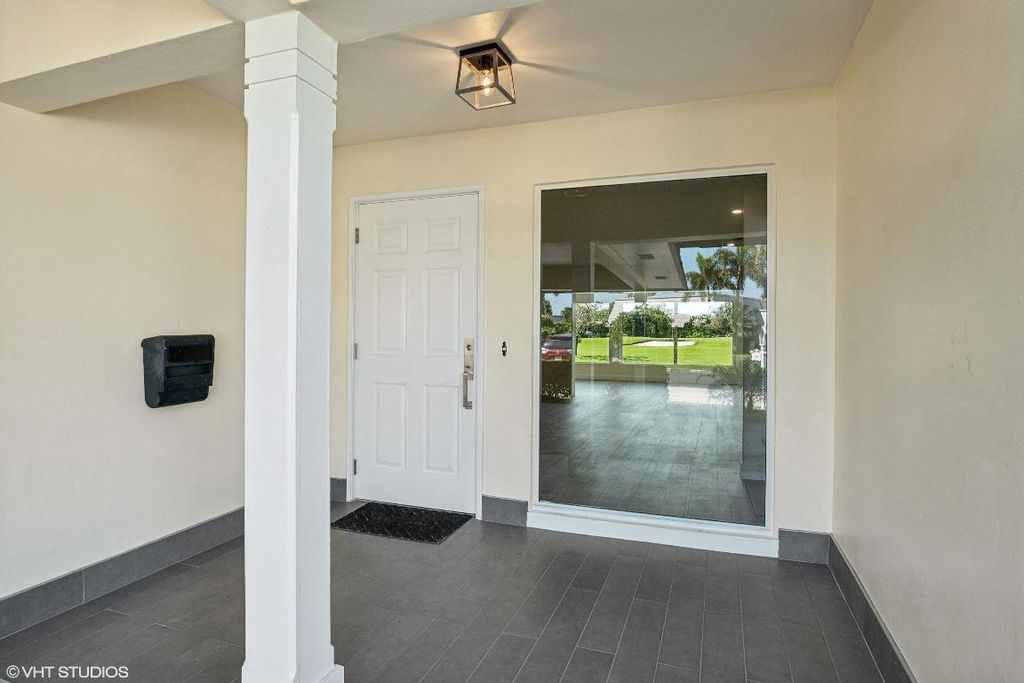 Photo of 422 French Royale Circle, Atlantis, FL 33462 (MLS # R10973466)