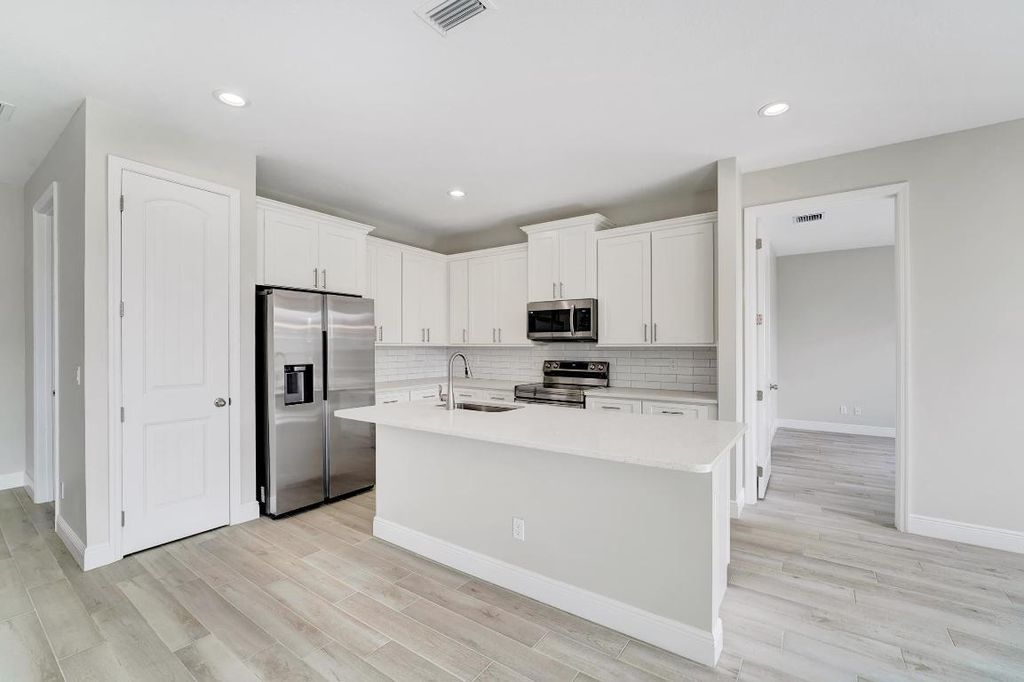 Photo of 556 SW Laconic Avenue, Port Saint Lucie, FL 34953 (MLS # R10943434)