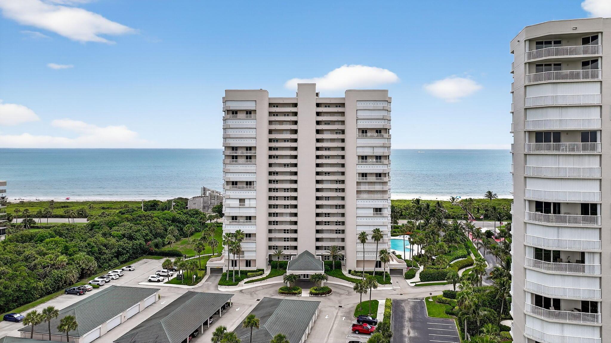 Welcome to a world where luxury meets the lull of the Atlantic--where morning walks on the private deeded beach are just steps away, and sun-kissed afternoons are spent lounging by the sparkling seaside pool. This magnificent 1st-floor Northeast corner condominium is the crown jewel of oceanfront living, offering 1,724 square feet of elegantly finished interior space and a staggering 900+ square feet of wraparound balcony to soak in endless sea breezes and panoramic coastal views.Boasting 3 spacious bedrooms and 2 spa-like bathrooms, this coastal retreat blends the exclusivity of a private residence with all the indulgences of a high-end resort. Open the sliders and feel the ocean mist kiss your skin--no elevator, no fuss, just seamless indoor-outdoor living in paradise.