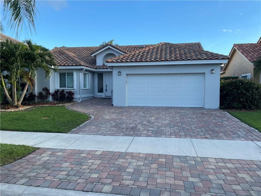 Photo of 645 Spinnaker, Weston, FL 33326 (MLS # B26025367)