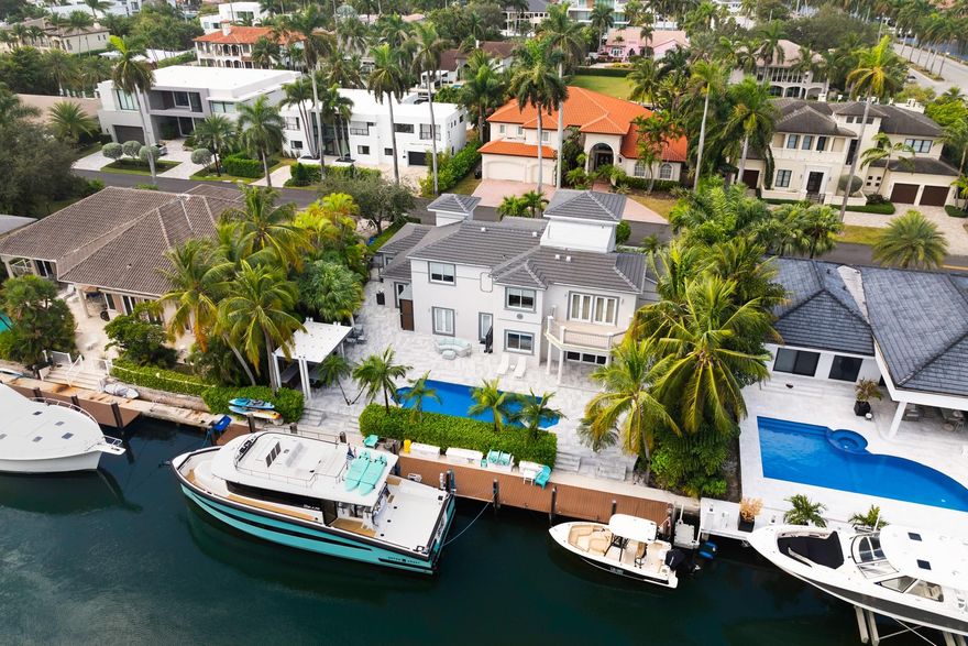 Welcome to 310 San Marco Dr, a waterfront gem in Las Olas Isles where luxury and fun meet! This 4,227 sq ft home boasts four spacious bedrooms, a home office, and 3.5 bathrooms—plenty of room for all your adventures. With 100 feet of dockage and quick ocean access, boat lovers will be in heaven. Inside, the gourmet kitchen is ready for your culinary creations with a 60" gas range. Step outside to your entertainer’s paradise! The backyard is upgraded with new porcelain pavers, and a covered summer kitchen/bar that’s practically begging for a BBQ bash. Relax by the heated pool and spa, plus, a whole-house generator and new AC for the garage to ensure you're always set for fun—no matter what! New Roof, well maintained seawall, impact glass and more. Ready to make a splash?