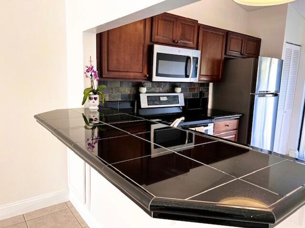 Photo of 10323 Boca Bend #K4, Boca Raton, FL 33428 (MLS # R11058182)