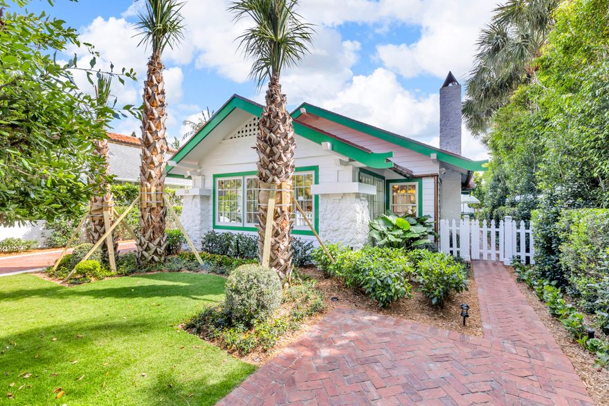 Rare Opportunity to Own a Piece of Palm Beach History. Step back in time when you enter this historic one-story Bungalow, originally built circa 1918. Landmarked by the current owner in November 2023, the home has been completely and lovingly renovated and preserved. This charming Bungalow features impact resistant, Double Hung Andersen windows, a new asphalt shingle roof, copper gutters, Detroit brick walkways, white picket fences and a delightful water fountain feature in the rear yard. Interiors boast original pecky cypress ceilings with matching built-in hutch, a gas fireplace, and an exceptional Jim Dove Design gourmet kitchen, featuring a handsome La Cornue gas stove and leaded glass in the cabinetry. Amazingly, this lot features not one, but two standalone houses! The main house has two bedrooms and two marble baths. The rear cottage features one bedroom and one bath and a full kitchenette with Miele appliances.

The two structures are excellent examples of the Bungalow style of architecture popular in the early twentieth century. Their distinguishing characteristics include the original cypress clapboard siding, low-pitched gable roofs with wide cave overhangs, and exposed rafter tails plus the original front porch Coral stone piers, which match the tall chimney constructed of the same. The landscaping is comprised entirely of Florida native plantings.