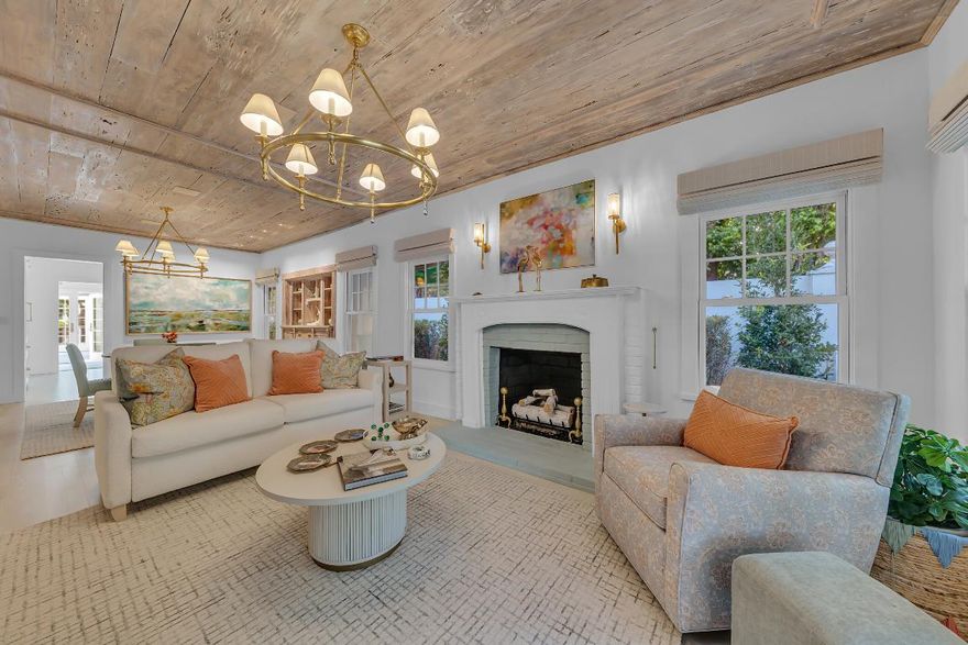 Rare Opportunity to Own a Piece of Palm Beach History. Step back in time when you enter this historic one-story Bungalow, originally built circa 1918. Landmarked by the current owner in November 2023, the home has been completely and lovingly renovated and preserved. This charming Bungalow features impact resistant, Double Hung Andersen windows, a new asphalt shingle roof, copper gutters, Detroit brick walkways, white picket fences and a delightful water fountain feature in the rear yard. Interiors boast original pecky cypress ceilings with matching built-in hutch, a gas fireplace, and an exceptional Jim Dove Design gourmet kitchen, featuring a handsome La Cornue gas stove and leaded glass in the cabinetry. Amazingly, this lot features not one, but two standalone houses! The main house has two bedrooms and two marble baths. The rear cottage features one bedroom and one bath and a full kitchenette with Miele appliances.

The two structures are excellent examples of the Bungalow style of architecture popular in the early twentieth century. Their distinguishing characteristics include the original cypress clapboard siding, low-pitched gable roofs with wide cave overhangs, and exposed rafter tails plus the original front porch Coral stone piers, which match the tall chimney constructed of the same. The landscaping is comprised entirely of Florida native plantings.