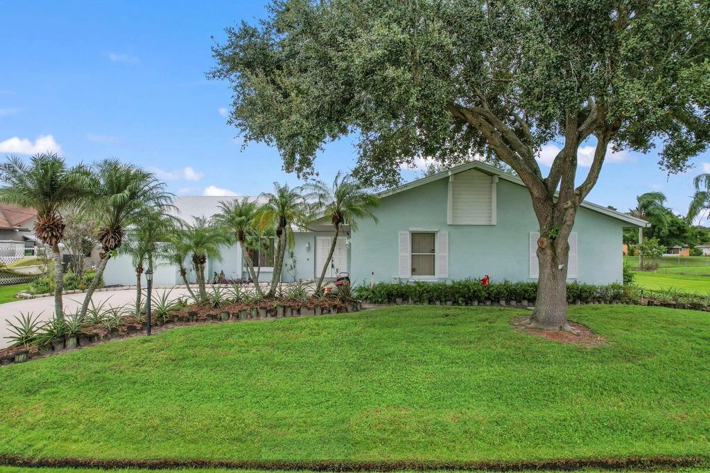 Photo of 2241 SE Leithgow Street, Port Saint Lucie, FL 34952 (MLS # R10925681)