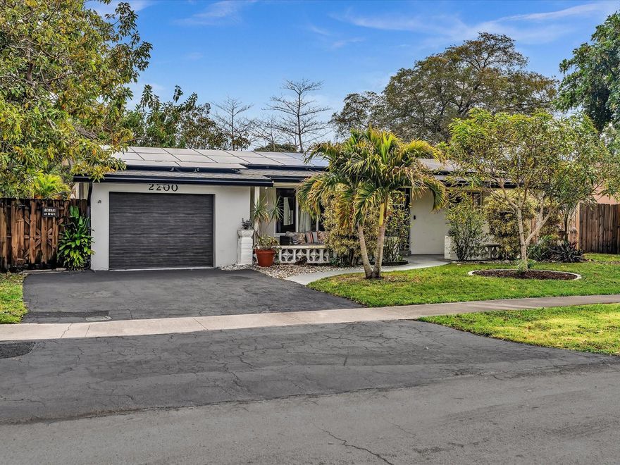 Beautifully updated South Florida home with no HOA, combining modern upgrades, energy efficiency, and exceptional outdoor living. The renovated kitchen features quartz countertops, stainless steel appliances, and a pass-through window perfect for entertaining. Both bathrooms are tastefully updated, and upgraded flooring runs throughout. Enjoy peace of mind with impact windows and doors, a new roof, and fully paid-off solar panels for long-term savings. Situated on an oversized lot with tranquil canal views, the private backyard is an entertainer’s paradise with a sparkling pool, relaxing hot tub, new pergola, mature avocado, mango, and lime trees, plus a shed for extra storage. A rare move-in-ready opportunity—schedule your private showing today.