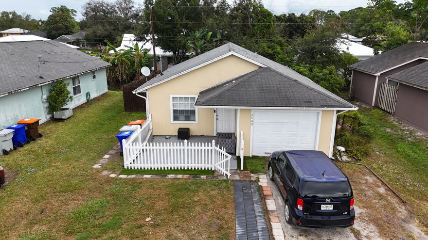 This charming home is being sold as is. It features two bedrooms and two bathrooms, with a remodeled garage that has been converted into an additional living space (a big room that can serve as another bedroom). The enclosed porch now serves as a cozy living room and kitchen area. The entire house boasts new tile flooring and upgraded bathrooms. The kitchen has been freshly painted, and new tiles have been added to the backsplash, giving it a modern and refreshed look.Additionally, there's great rental potential, as one section of the house can be used as a separate unit. This section includes its own bedroom, bathroom, kitchen, and a walk-in closet, plus a separate entrance for privacy.