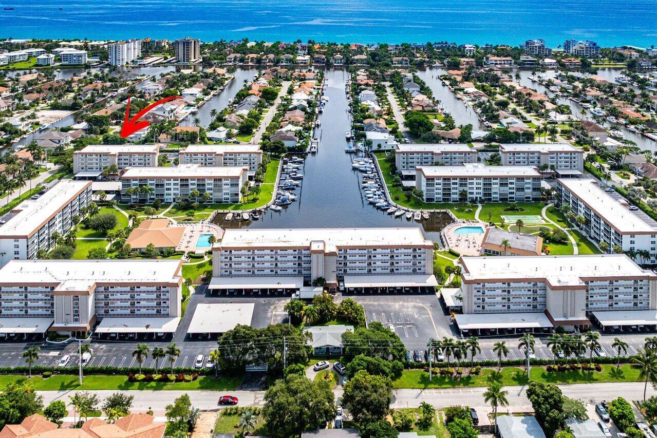 'WATERFRONT' BOATING COMMUNITY-RESORT STYLE LIVING-BEAUTIFUL FULLY REMODELED BY DESIGNER/OWNER-RARELY AVAILABLE PENTHOUSE CORNER UNIT-MOST SOUGHT AFTER EAST FACING WITH COMPLETE HIGH IMPACT WINDOWS & DOORS-WASHER & DRYER-COVERED PARKING-BONUS STORAGE/BIKE ROOM. THIS 2 BEDROOM EN-SUITES IS MODEL PERFECT FURNISHED WITH TOP OF THE LINE FINISHES, NO DETAIL OVERLOOKED. YES, 'WOW' FACTORS IN EVERY ROOM! GE CAFE SERIES KITCHEN APPLIANCES, WHITE QUARTZ COUNTERS SHOWS SUBTLE WARM TONES, 5 INCH OPEN SLAT PLANTATION SHUTTERS ALLOWS A VOLUME OF LIGHT + VISIBILITY, PORCELANOSA TILE THROUGH OUT, CUSTOM CLOSETS, EMTEK GLASS DOOR KNOBS, NEW FURNITURE AVAILABLE FOR SALE. 1.2 MILES TO THE BEACH..3 HEATED SALTWATER POOLS..CLUBHOUSE..ACTIVE SOCIAL/CARD/GOLF/YACHT CLUBS..53 BOAT SLIPS..SO MUCH MORE!!!