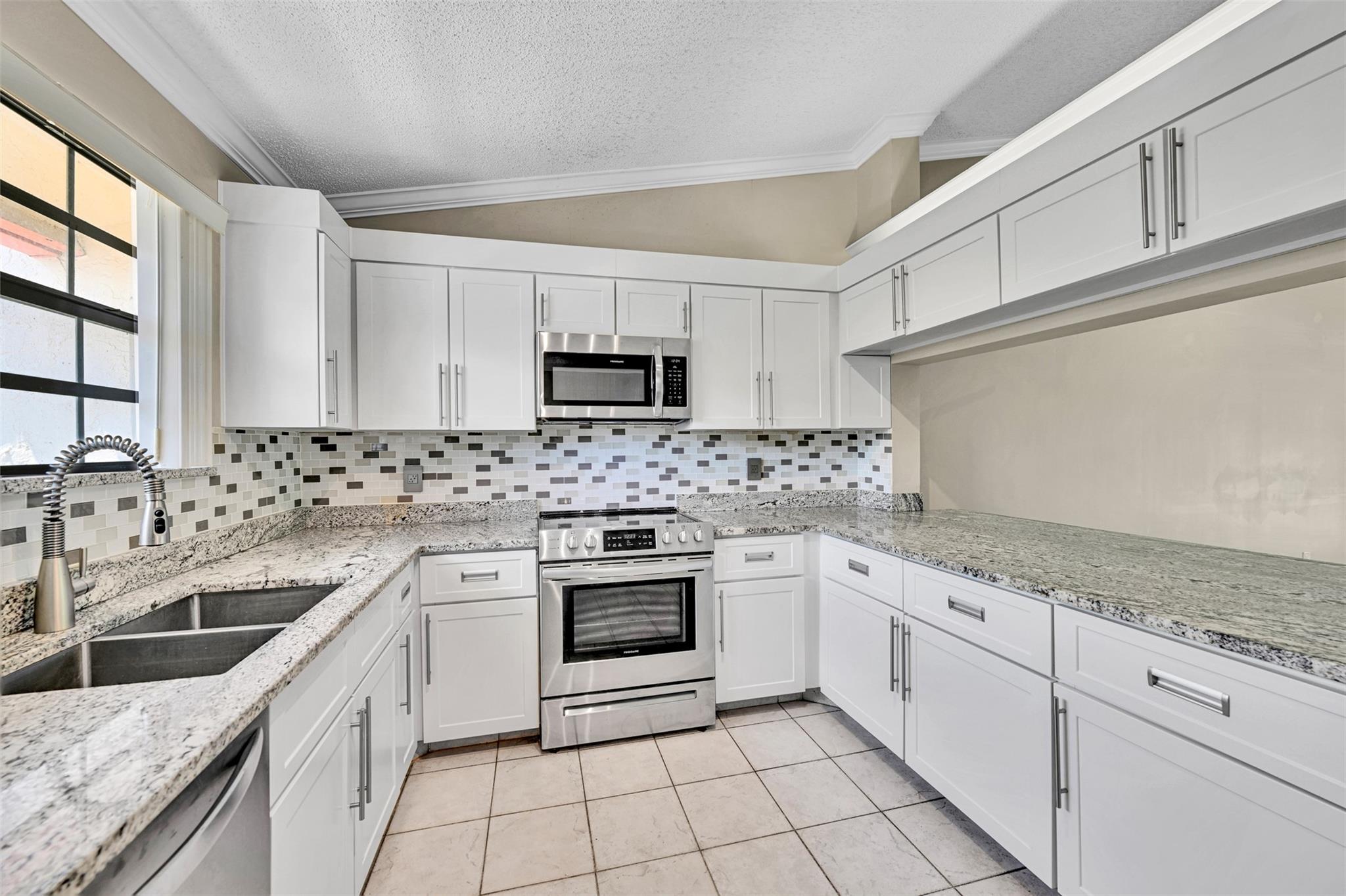 Fabulous spacious condo located in Independence Bay. This unit has a nice open vaulted split bedroom plan with updated granite kitchen with ss appliances, large primary suite with walk in closet, primary bathroom includes walk in shower. Nice size guest bedroom and guest bath. Huge vaulted open living room area that leads to double sliders to screened in porch which overlooks nice serene exterior with no obstructed views. Newer AC and washer/dryer, crown molding throughout. Independence Bay is a 24 hour gated community with resort like amenities include, 5 pools, tennis, pickleball, basketball/handball courts, fitness center, walking/biking path and near major interchanges for easy commuting, 5 miles to beach. Bonus walk up attic storage. Come see this gem fast before its gone.