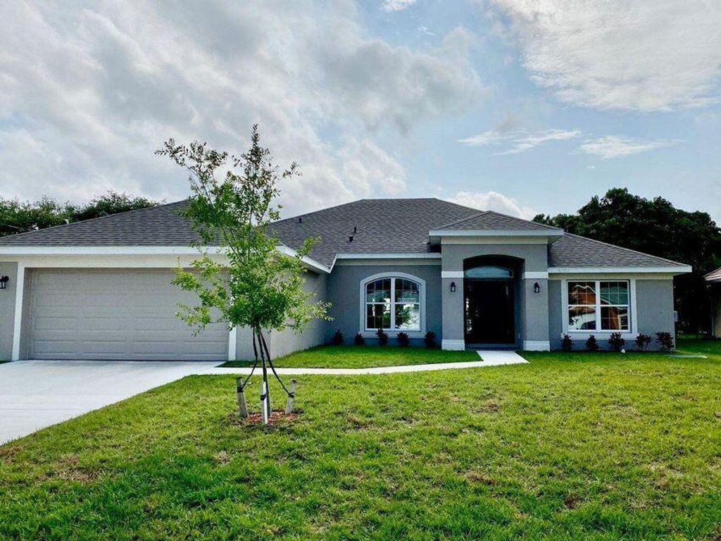 Photo of 5872 NW Corso Avenue, Port Saint Lucie, FL 34986 (MLS # R10800957)
