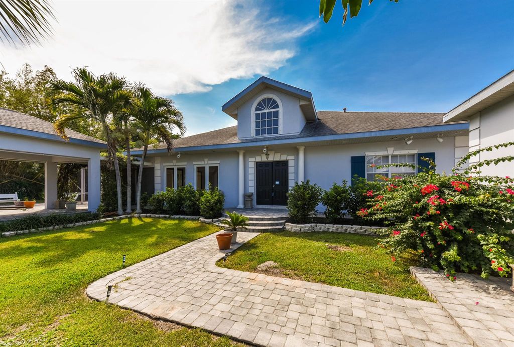 Photo of 11900 SE Plutus Avenue, Hobe Sound, FL 33455 (MLS # R11009508)