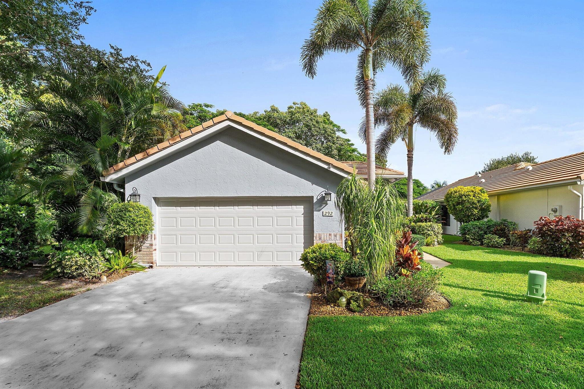 Paradise found! Set against a backdrop of blossoming tropical plants and trees nestled in a private community just 5 minutes from Downtown Delray. CBS built, 3 Bedrooms, 2 Bathrooms, 2 Car Garage, enjoy a split floorplan with high ceilings, light and bright, and plenty of room for family and guests. The 3rd bedroom currently used as a Den. Neutral flooring and cabinet colors allow for you to make it your own. Make your way outside to your private screened-in patio and oversized yard, perfect for entertaining or enjoying quiet time. There's even plenty of room to add a pool. The HOA maintenance fee includes a gated entry, lawn care, cable, exterior home painting. We have shared access for a limited time to the brand-new clubhouse and amenities from Enclave community. Close to fine dining.