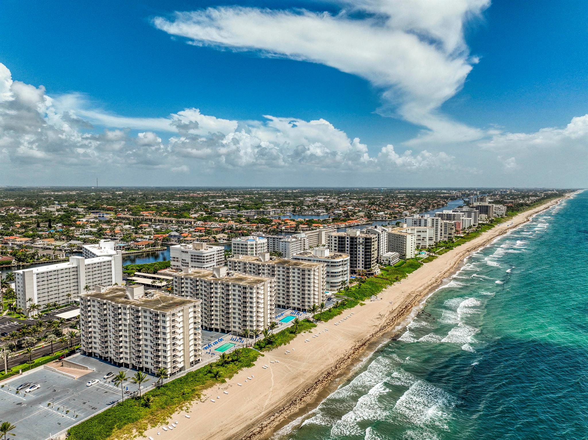 Corner-unit condo with stunning ocean & Intracoastal views from two private balconies! Split-bedroom layout with open living/dining area, updated kitchen, and tile flooring. Primary suite features walk-in closet & en-suite bath with granite vanity. Guest room doubles as den or office. Enjoy resort-style amenities: 2 pools, sauna, billiards, beach access & covered parking. Gated, quiet Highland Beach community just minutes to Atlantic Ave & Mizner Park. Furnished & move-in ready for full-time or seasonal living!