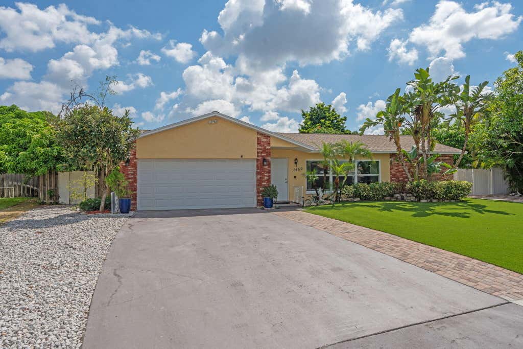 Photo of 1460 Woodcrest Road E, West Palm Beach, FL 33417 (MLS # R11118902)