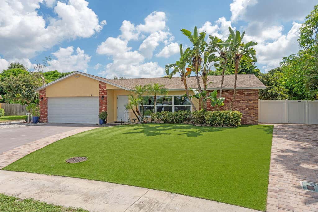 Photo of 1460 Woodcrest Road E, West Palm Beach, FL 33417 (MLS # R11118902)