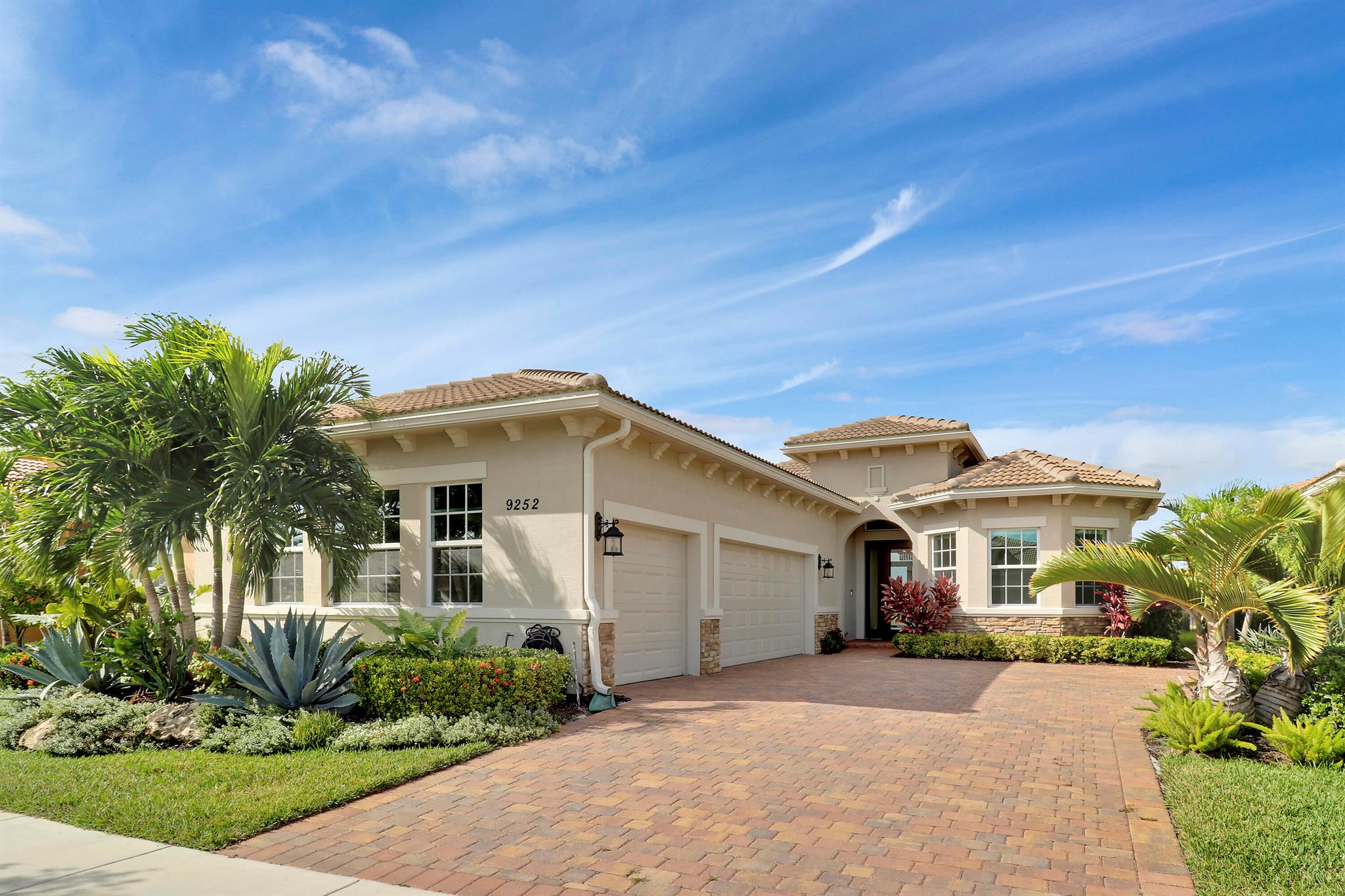 DEEP LAKE FRONT LOT ON A CUL-DE-SAC WITH A SPACIOUS, FENCED BACK YARD AND A THREE CAR GARAGE IN THE RESORT STYLE 55+ NEIGHBORHOOD OF CRESSWIND AT VERANO! Don't miss this tastefully upgraded home that is completely move-in ready! This 2BR+Den/2BA/3CG 'Isabella' floor plan was built in 2022 and is brimming with practical and stylish upgrades including decorative stone work on the front exterior, impact glass windows & doors, an oversized fenced yard, extended paver patio, glass entry front door, wallpaper accent wall, upgraded light fixtures t/o, hihat lighting in almost all the rooms, wood-look plank flooring through the main living areas & den, plush carpeting in the bedrooms, upgraded tiled bathrooms and more.