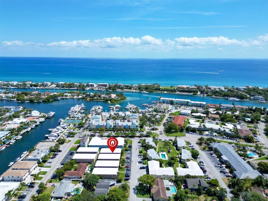 This MOVE IN READY condo offers  CUSTOM UPGRADES AND DESIGNS throughout including FULL SIZE WASHER/DRYER INSIDE UNIT~ IMPACT WINDOWS AND DOORS and PLANTATION SHUTTERS~ ASSIGNED PARKING SPACE~ Unit offers spacious bedroom with DUAL CLOSETS giving ample space and open courtyard area perfect for your morning sunrise or your evening sunset~ nestled away inside Lighthouse Point's Marina area offering perfect waterfront options of dining, shopping and entertainment. Truly your chance to own this slice of PARADISE! Schedule a tour today!