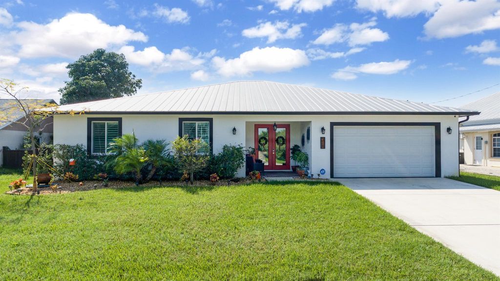 Photo of 314 NE Surfside Avenue Avenue, Port Saint Lucie, FL 34983 (MLS # R11117701)
